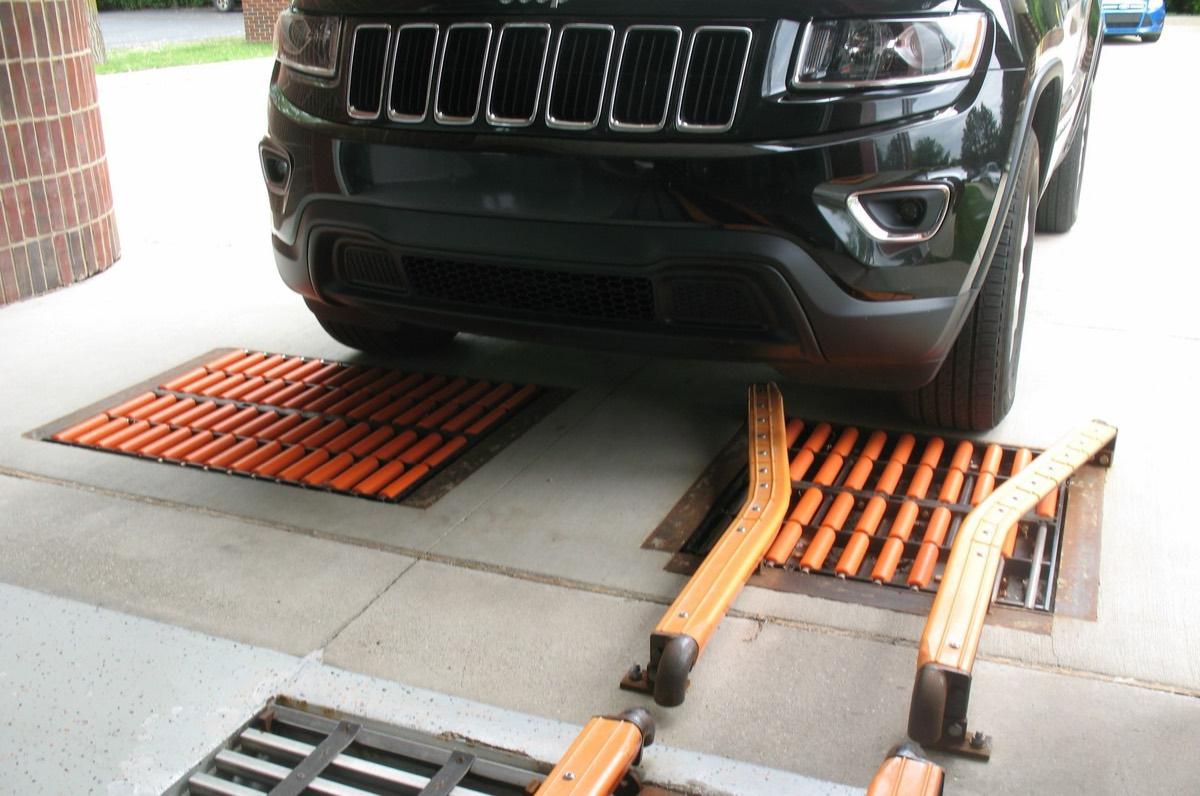 Belanger car wash correlator with stainless steel rollers at conveyor entry.